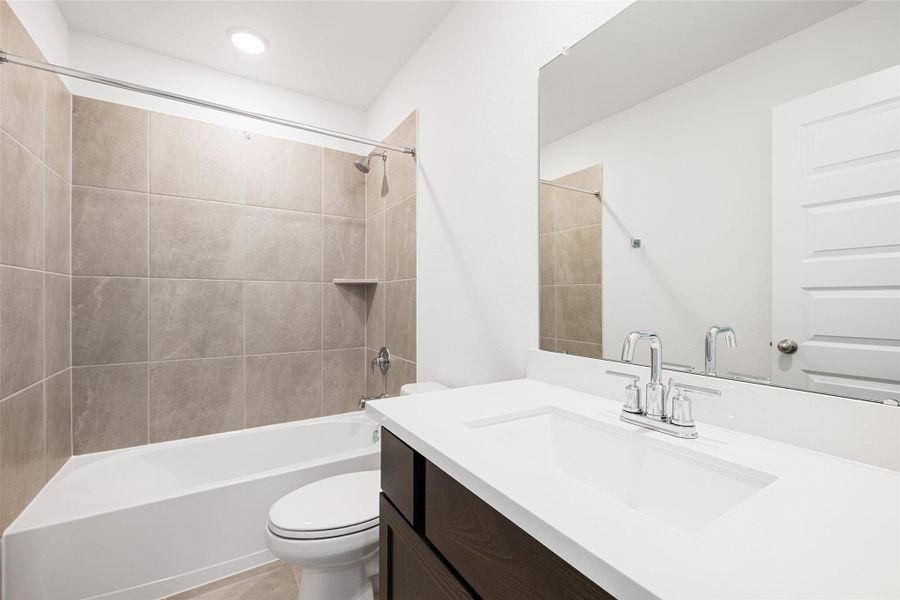 Furnished interior view inside a new home in Sunterra, Katy (Image 9).