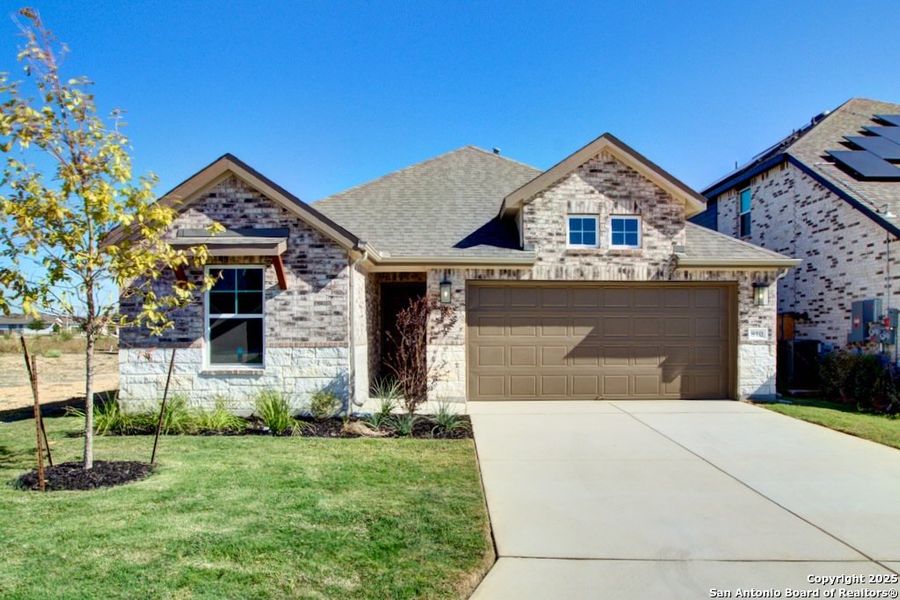 Front exterior of a new home in Sunflower Ridge, New Braunfels, TX, highlighting curb appeal (Image 1).