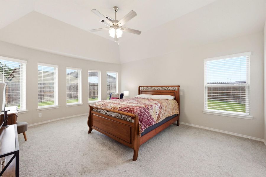 Oversized primary bedroom.  Abundance of natural light!