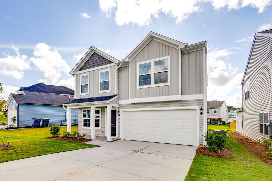 Front exterior of a new home in Bluefield, Lexington, SC, highlighting curb appeal (Image 20). Front exterior of a new home in Bluefield, Lexington, SC, highlighting curb appeal (Image 20).
