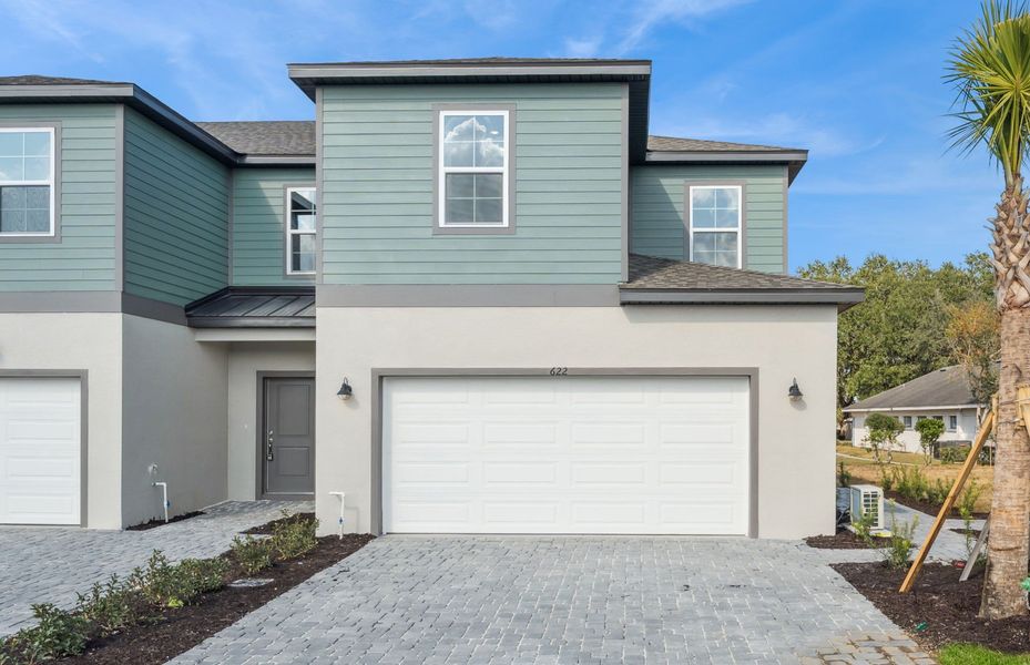 Front exterior of a new home in Connors Cove, Eustis, FL, highlighting curb appeal (Image 21).