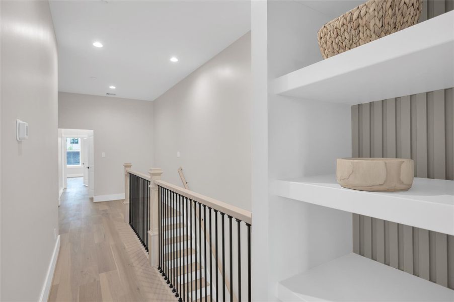 Built in shelving just off of primary bedroom