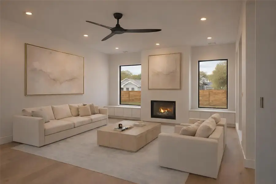 Living Room- Gas fireplace, engineered wide-plank floors, windows overlooking the beautiful expansive side yard. (Rendering)