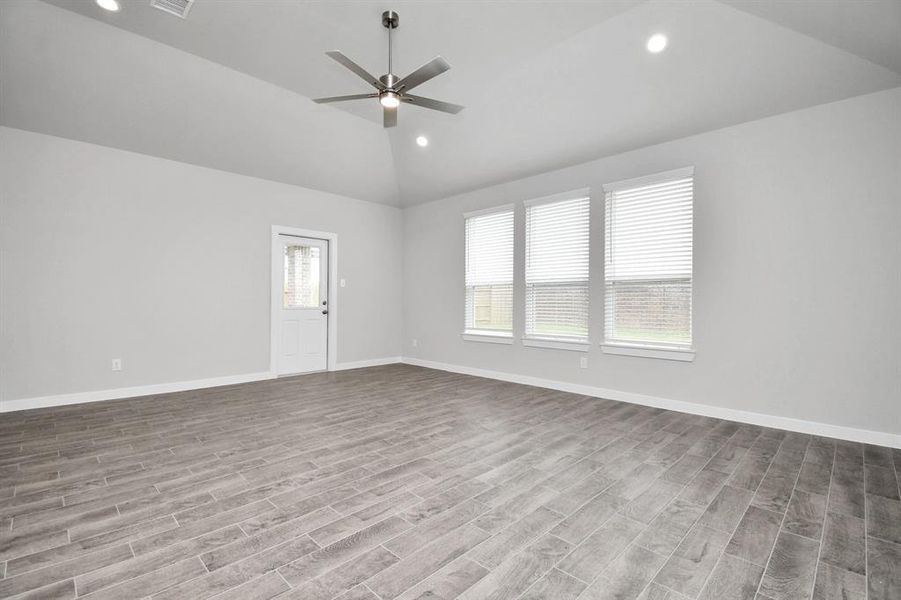 Another view of family room area. Sample photo of completed home with similar floor plan. Actual colors and selections may vary.