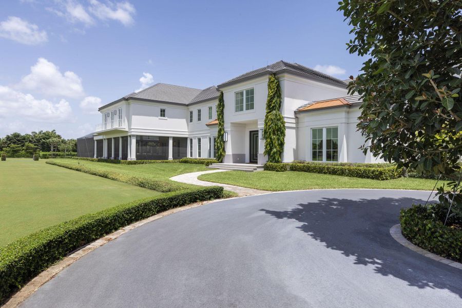 Front exterior of a new home in , Wellington, FL, highlighting curb appeal (Image 31). Front exterior of a new home in , Wellington, FL, highlighting curb appeal (Image 31).