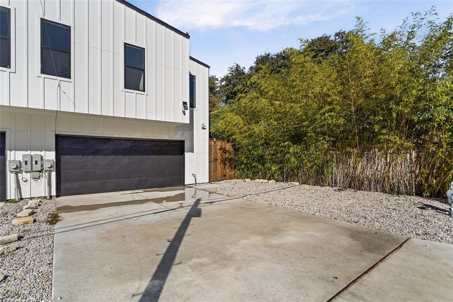 View of property exterior with a garage