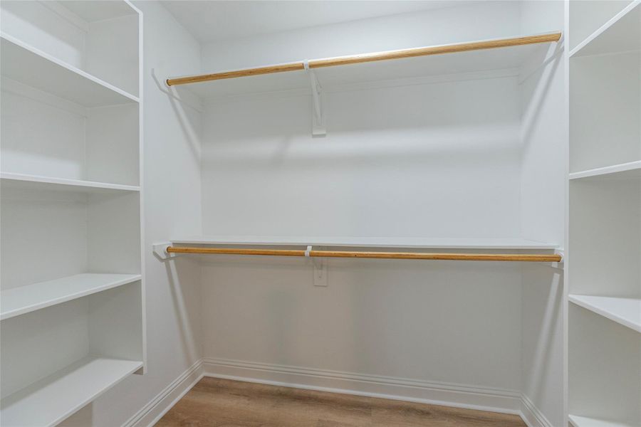 1 of 2 large walk in closets in the primary bedroom.