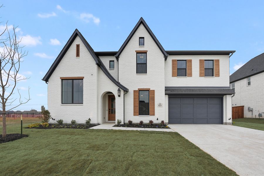 Front exterior of a new home in Park Place - 80' Lots, Prosper, TX, highlighting curb appeal (Image 1). Front exterior of a new home in Park Place - 80' Lots, Prosper, TX, highlighting curb appeal (Image 1).