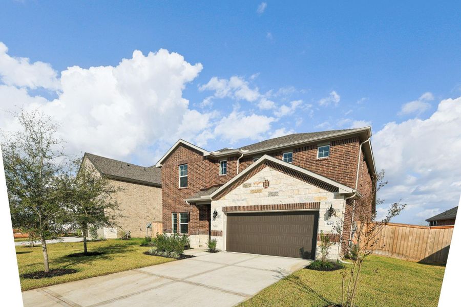 Front exterior of a new home in Massey Oaks - Premier Series, Pearland, TX, highlighting curb appeal (Image 1). Front exterior of a new home in Massey Oaks - Premier Series, Pearland, TX, highlighting curb appeal (Image 1).