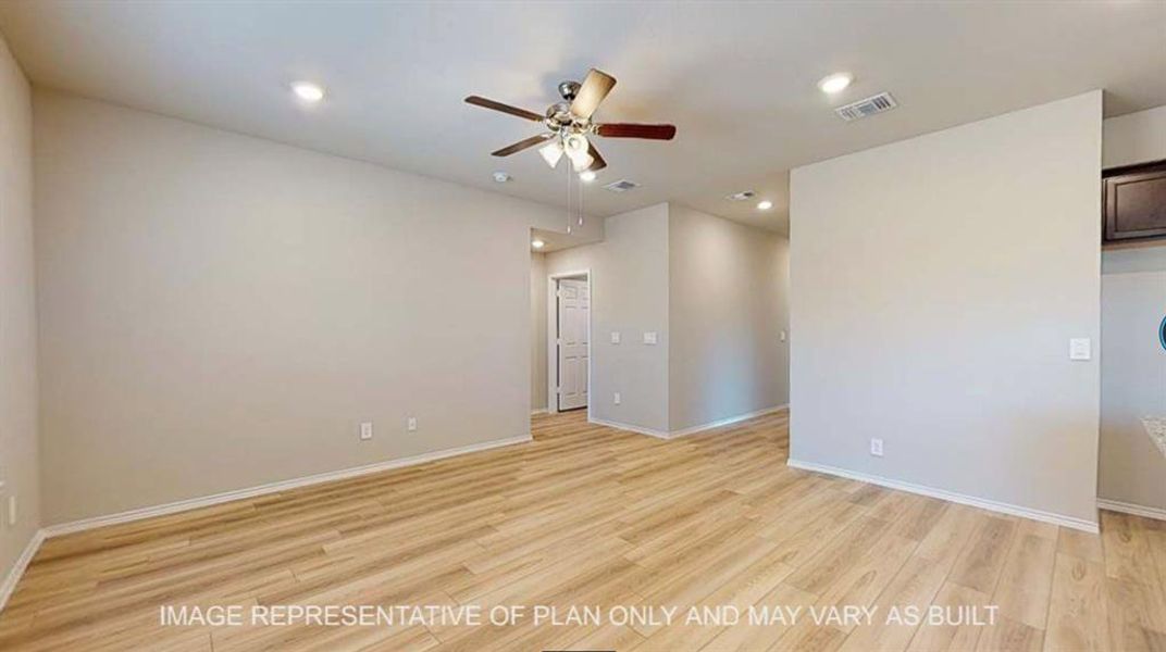 Unfurnished room featuring light wood finished floors, a ceiling fan, and recessed lighting