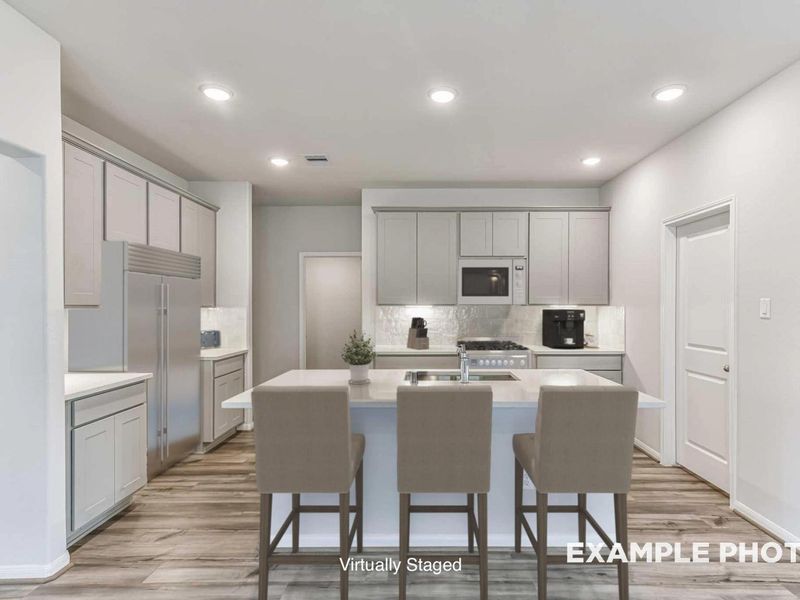 Furnished interior view inside a new home in Sunterra, Katy (Image 5).