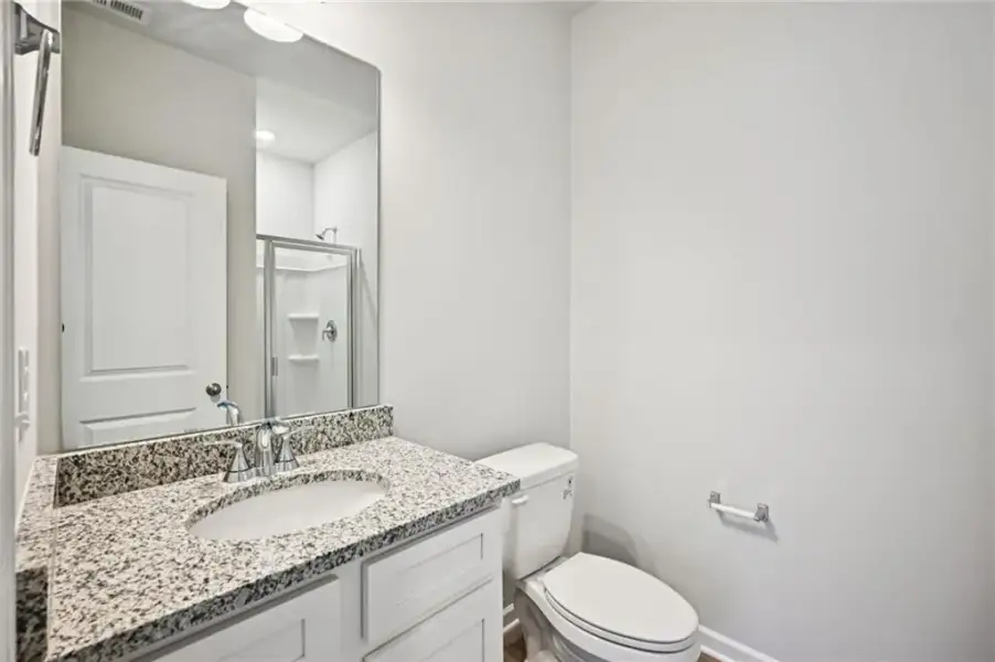 Furnished interior view inside a new home in The Hills at Cedar Creek, Winder (Image 24).