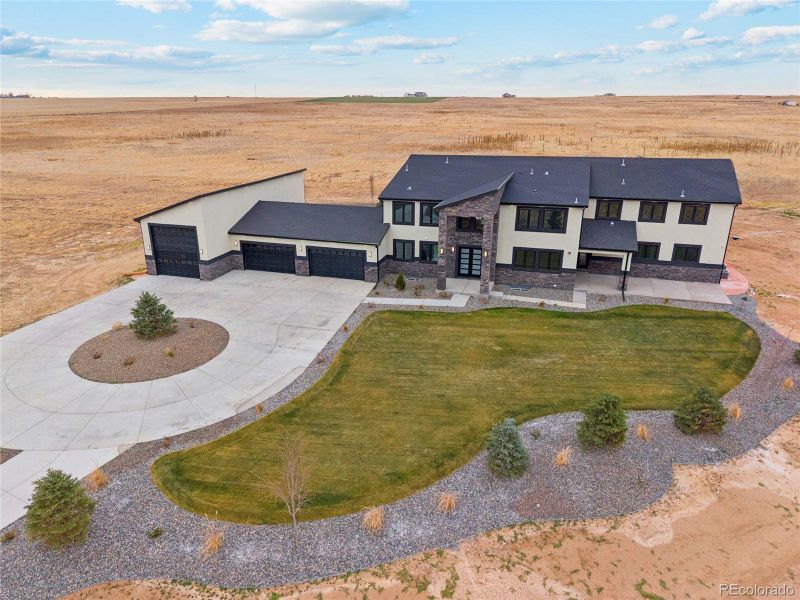 Front exterior of a new home in , Hudson, CO, highlighting curb appeal (Image 24).