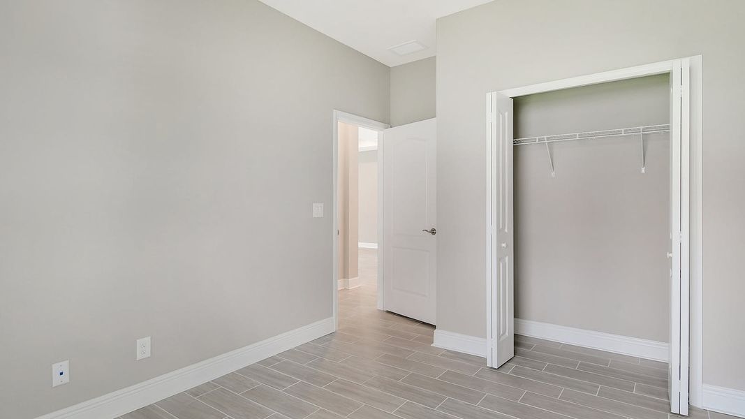Spacious, unfurnished interior of a new home in Canoe Creek Real Estate and Homes for Sale in Parrish, FL - Neal Communities, Parrish (Image 13).