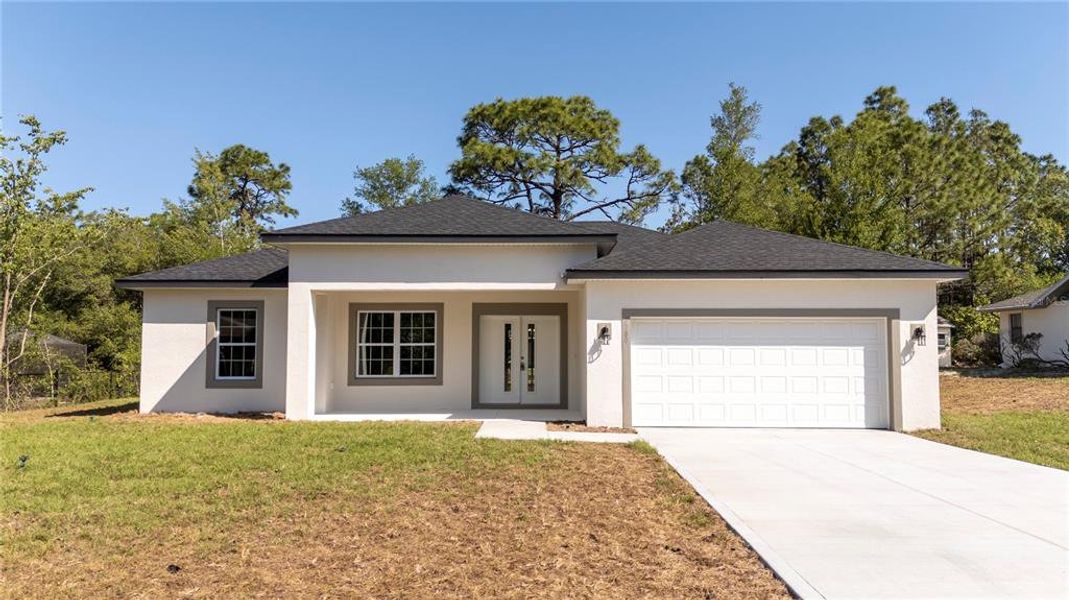 Front exterior of a new home in , Citrus Springs, FL, highlighting curb appeal (Image 19). Front exterior of a new home in , Citrus Springs, FL, highlighting curb appeal (Image 19).