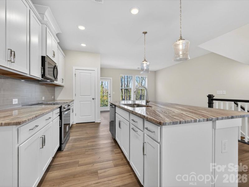 Furnished interior view inside a new home in Central Living at Craig, Charlotte (Image 9).