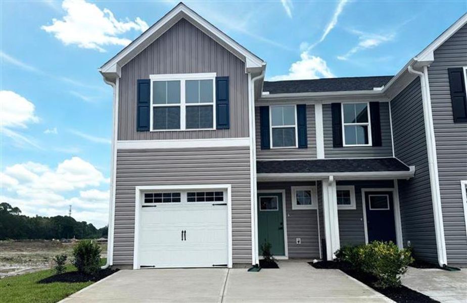 Front exterior of a home in the Bell Creek Townhomes community, located in Winnabow, NC (Image 12).
