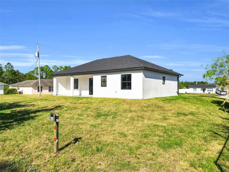 Exterior details and patio area of a home in , Lehigh Acres (Image 3).