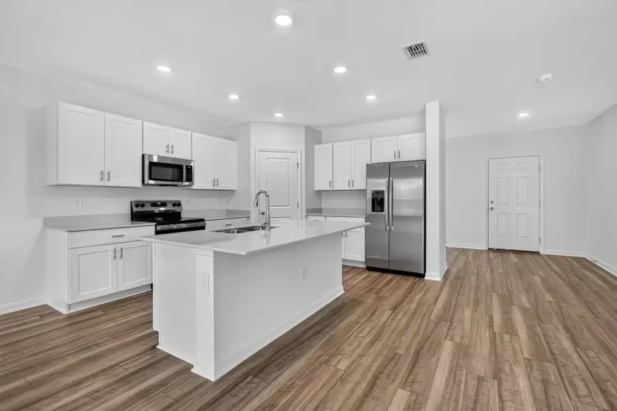 Representative furnished interior of a home built from the Kingfisher by Taylor Morrison in Palm Wind, Hudson (Image 3).
