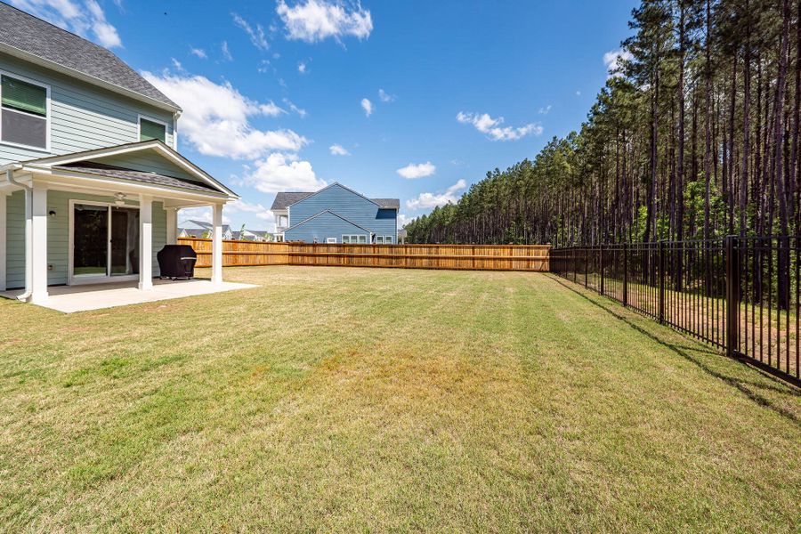 Exterior details and patio area of a home in , Ravenel (Image 33). Exterior details and patio area of a home in , Ravenel (Image 33).