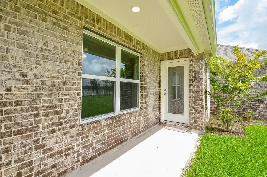 Exterior details and patio area of a home in Sunterra, Katy (Image 1).