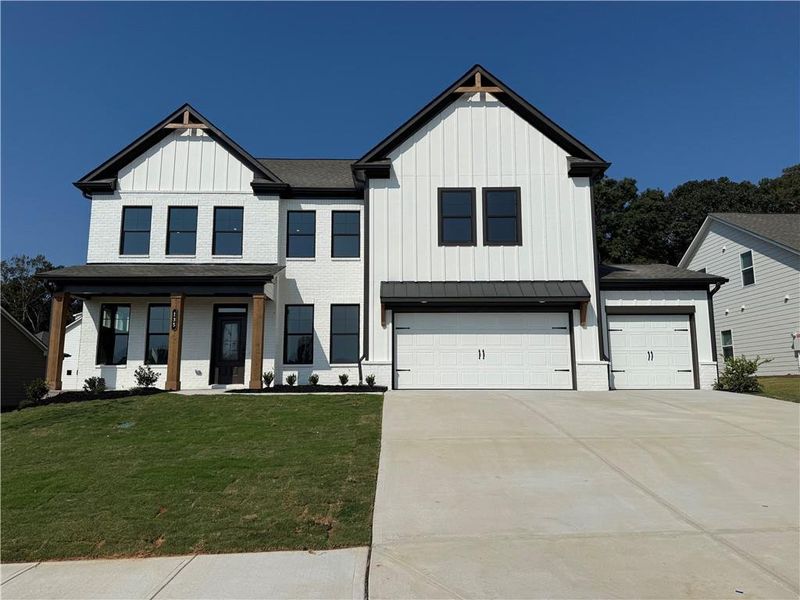 Front exterior of a new home in Rosewood Lake Estates, Hoschton, GA, highlighting curb appeal (Image 66).