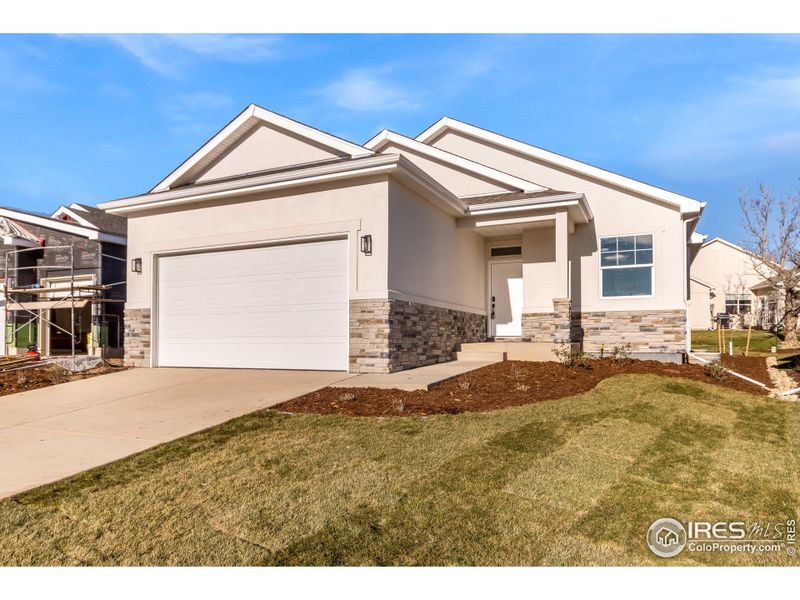 Front exterior of a new home in , Eaton, CO, highlighting curb appeal (Image 1).