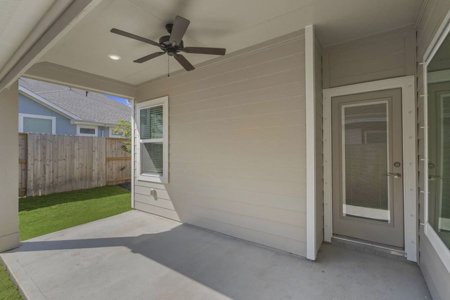 Representative exterior details of a home built from the Carriagehouse by Chesmar Homes in Meridiana Townhomes, Iowa Colony (Image 42).