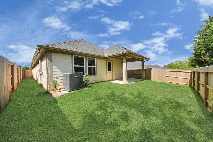 Exterior details and patio area of a home in Montgomery Ridge: Landmark Collection, Montgomery (Image 24).