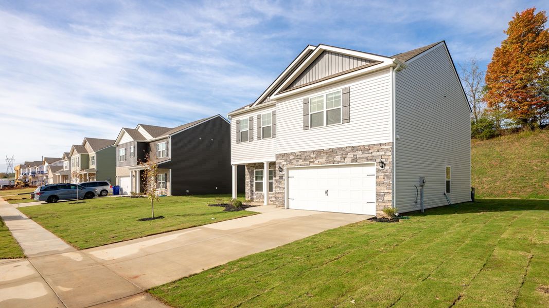 Representative exterior photo of a completed home built from the Penwell by D.R. Horton in Lone Oaks Farm, Cleveland, TN (Image 24).