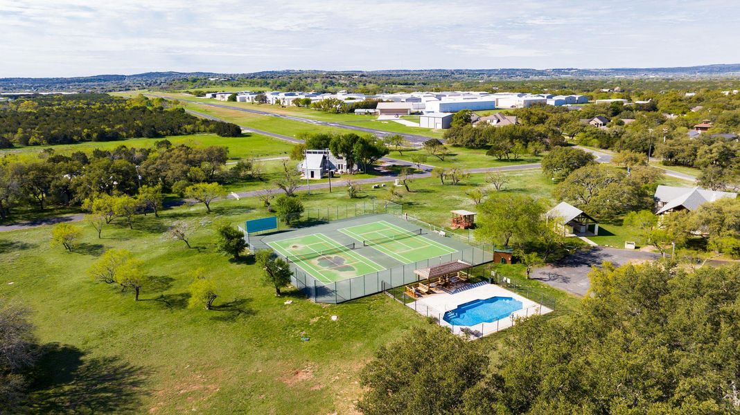 Drone / aerial view of community pool, tennis courts and pavillion Drone / aerial view of community pool, tennis courts and pavillion
