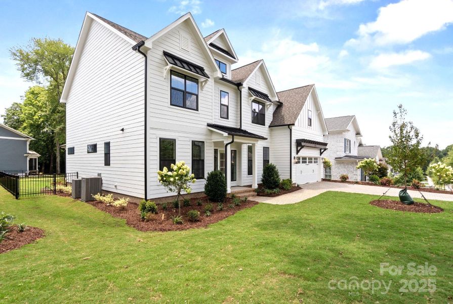 Front exterior of a new home in , Charlotte, NC, highlighting curb appeal (Image 22).