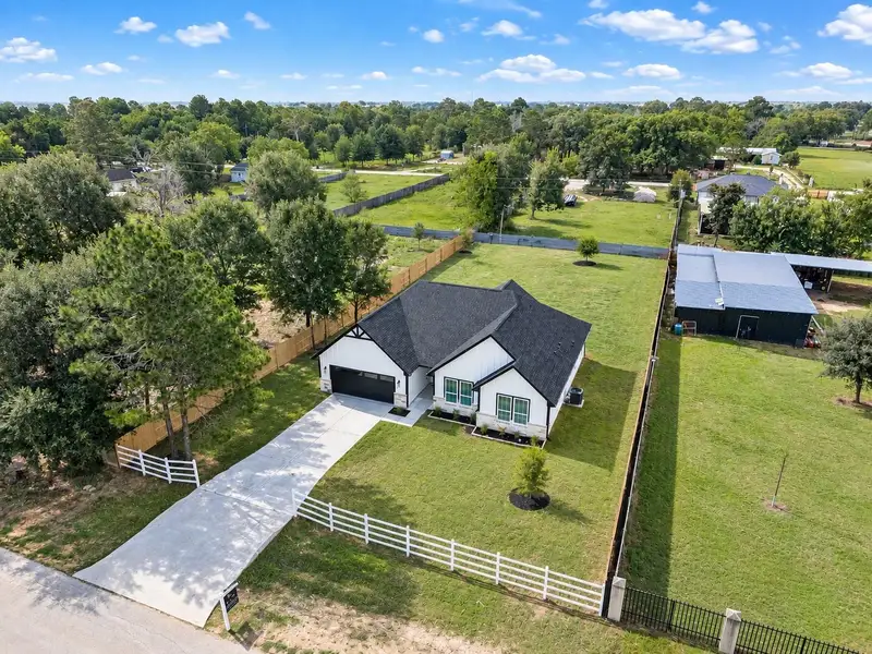 Front exterior of a new home in , Prairie View, TX, highlighting curb appeal (Image 26). Front exterior of a new home in , Prairie View, TX, highlighting curb appeal (Image 26).