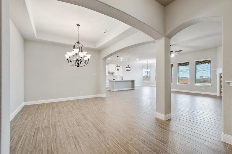 Dining Room to Kitchen | Concept 2373 at Coyote Crossing in Godley, TX by Landsea Homes Dining Room to Kitchen | Concept 2373 at Coyote Crossing in Godley, TX by Landsea Homes