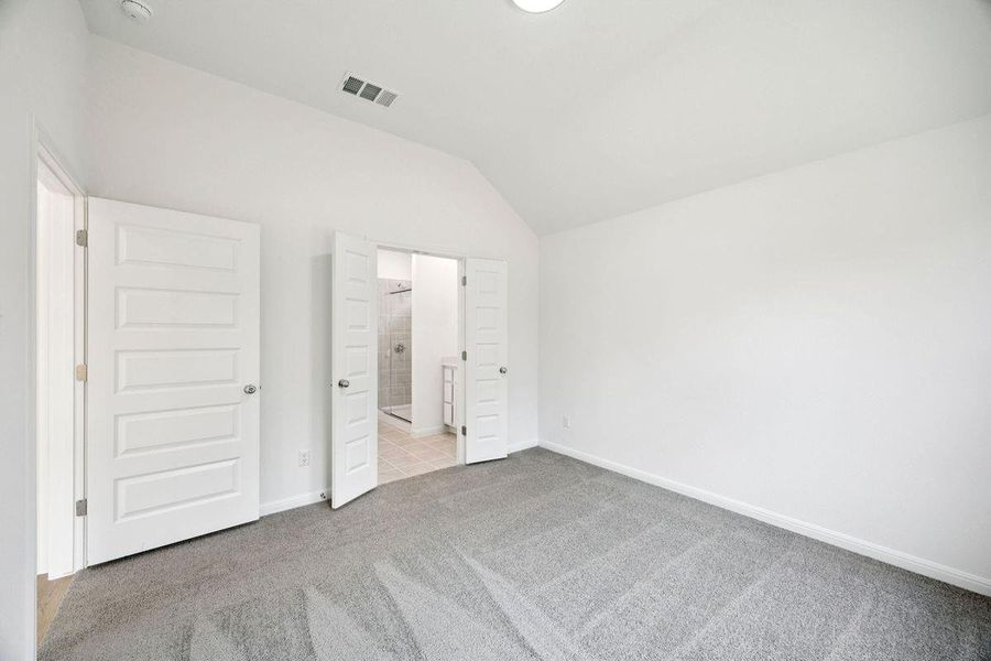 Primary Suite in the Spruce home plan by Trophy Signature Homes - REPRESENTATIVE PHOTO