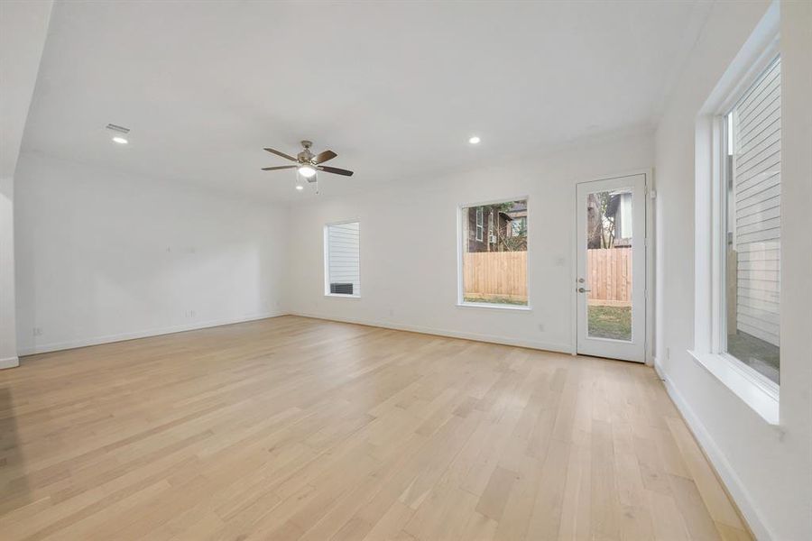 The Living area is open and spacious, and the large windows allow plenty of natural light to come in. (Sample photos of a completed Lisbon floor plan. The image may feature alternative selections and/or upgrades.)