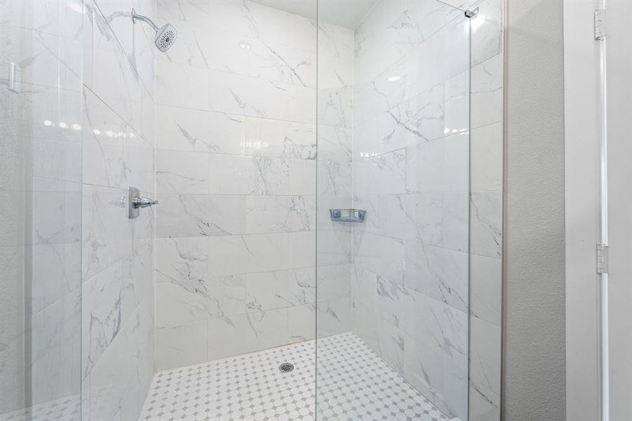 Full bathroom featuring a marble finish shower Full bathroom featuring a marble finish shower