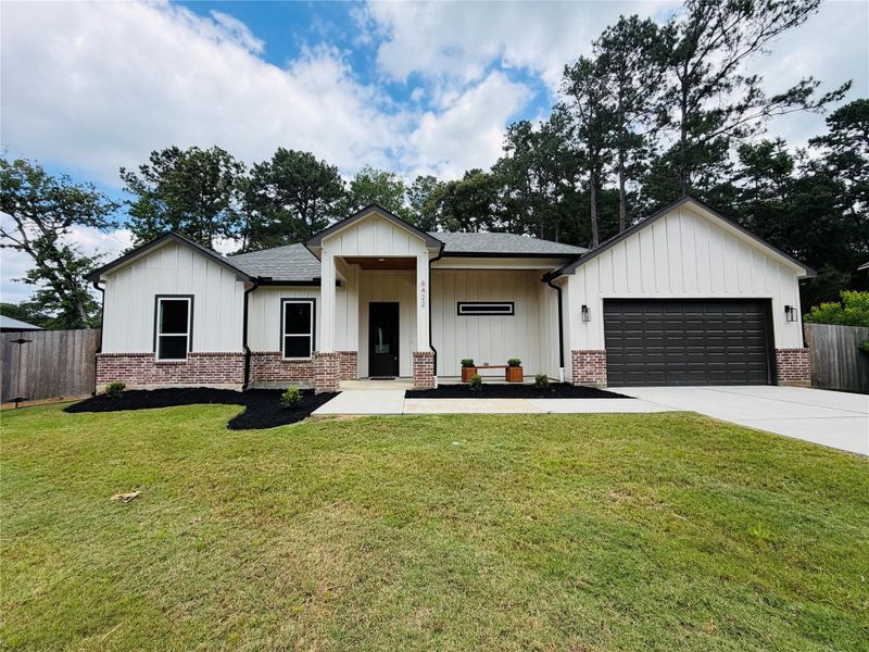 Front exterior of a new home in , Magnolia, TX, highlighting curb appeal (Image 20).
