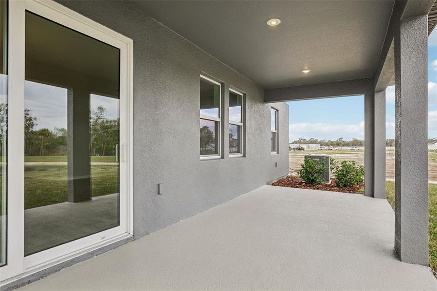 Exterior details and patio area of a home in Oakfield Trails, Parrish (Image 3).