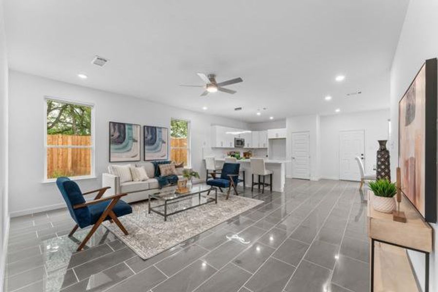 Living room with recessed lighting and a ceiling fan Living room with recessed lighting and a ceiling fan