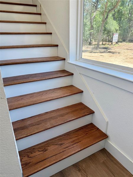 Staircase with art window leads to 3-2-loft Staircase with art window leads to 3-2-loft