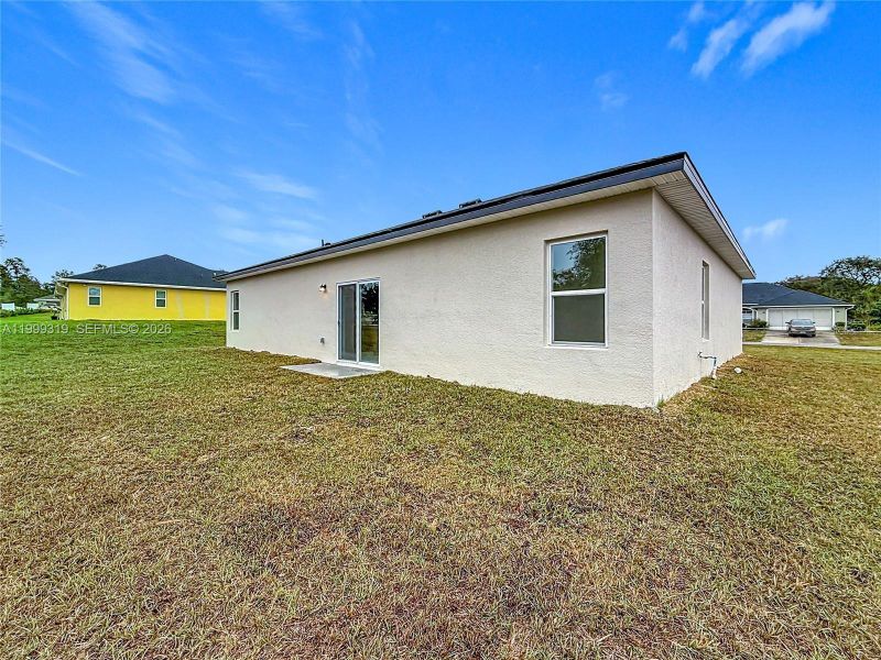 Exterior details and patio area of a home in , Ocala (Image 13).