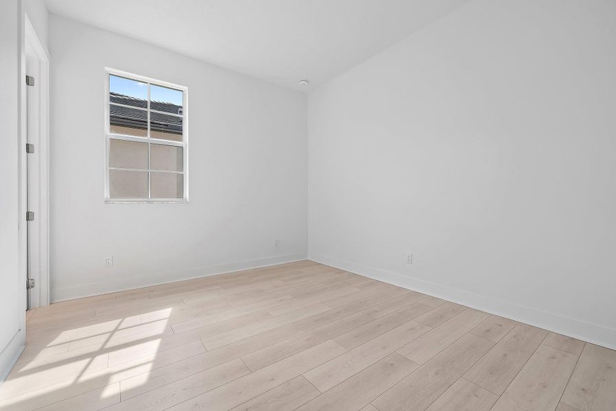 Spacious, unfurnished interior of a new home in L'Ambiance at Avenir, Palm Beach Gardens (Image 36).