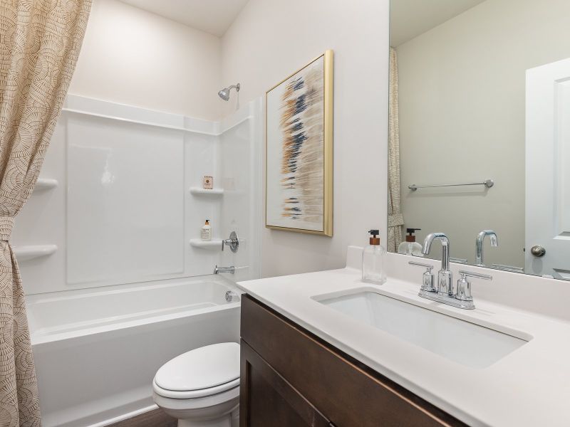 Secondary bathroom in the Chandler floorplan at a Meritage Homes community in Angier, NC.