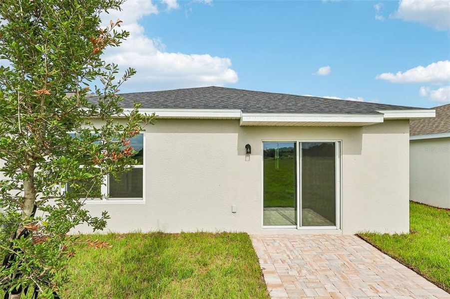 Exterior details and patio area of a home in Liberty Trace, Haines City (Image 19).