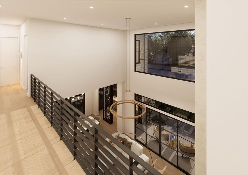 This expansive upper-level gallery overlooks the dramatic living space below, where oversized windows frame leafy views and flood the home with natural light. Sleek horizontal railings and warm wood flooring create a seamless blend of openness and modern refinement. This expansive upper-level gallery overlooks the dramatic living space below, where oversized windows frame leafy views and flood the home with natural light. Sleek horizontal railings and warm wood flooring create a seamless blend of openness and modern refinement.