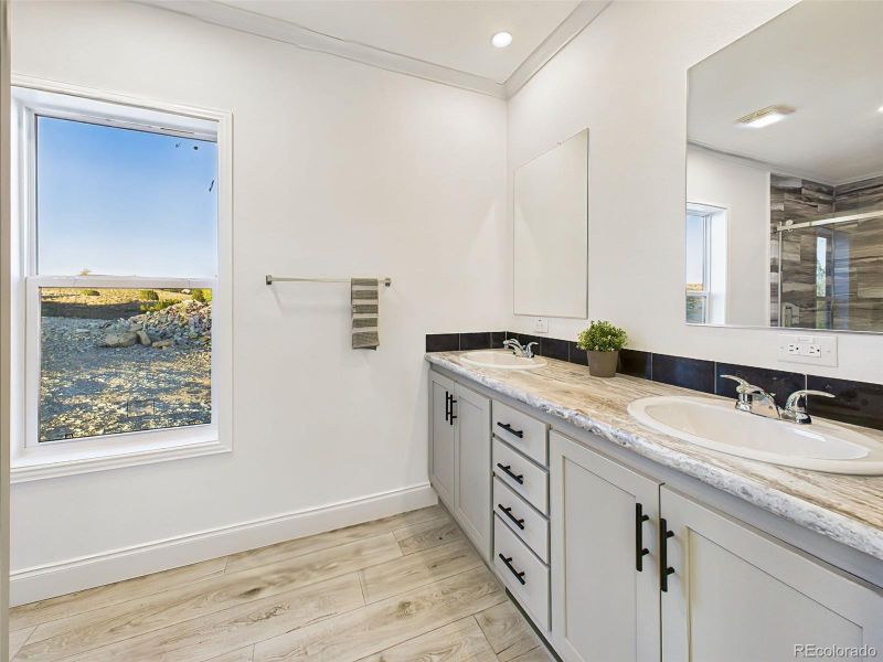 Beautifully appointed ensuite with dual sinks, and ample cabinetry. Beautifully appointed ensuite with dual sinks, and ample cabinetry.