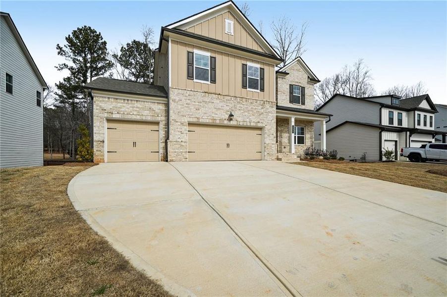 Front exterior of a new home in Rosewood Lake Estates, Hoschton, GA, highlighting curb appeal (Image 32).