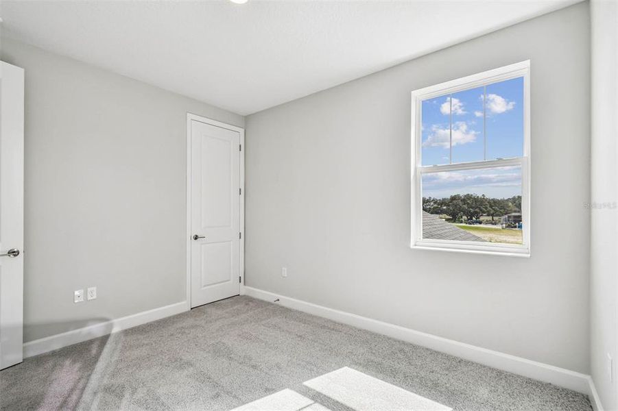 Spacious, unfurnished interior of a new home in Solace at Corner Lake, Orlando (Image 51).