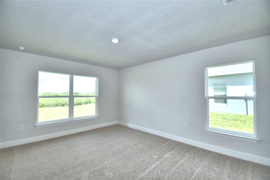Spacious, unfurnished interior of a new home in Cadence Crossing, Auburndale (Image 32).